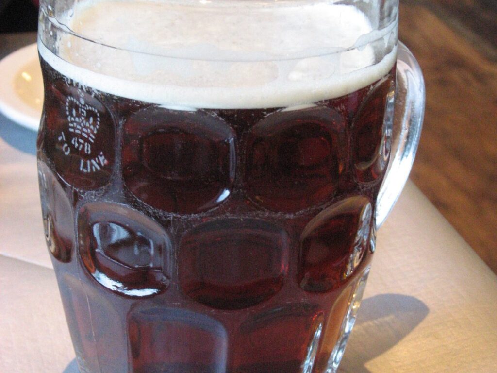 Is beer kosher: a glass of beer being poured, the kosher status question this post answers