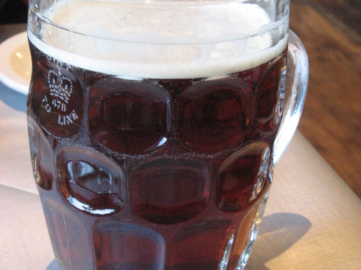 Is beer kosher: a glass of beer being poured, the kosher status question this post answers